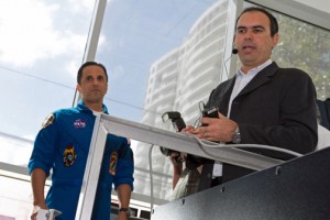 Astronaut Joe Acaba, left, looks on as Prof. Rafael Jiménez-Vélez, mechanical engineering professor, explains the flight simulator's featured.