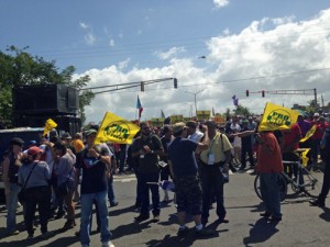 Dozens of protestors gathered Sunday to express their dissatisfaction over the transaction between the government and Aerostar Airport Holdings.