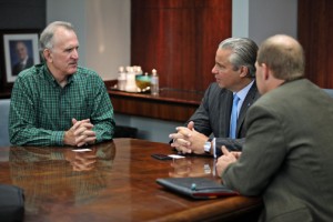 (From left) Pattern Energy CEO Mike Garland meets with Economic Development and Commerce Secretary Alberto Bacó, as Hunter Armistead, Pattern Energy's executive director listens.
