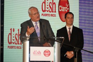 DISH Network Corp. CEO Joseph P. Clayton (at podium) and Claro Puerto Rico President Enrique Ortiz de Montellano speak during Tuesday's presentation.