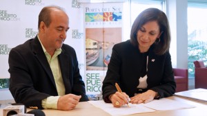 PRTEC Executive Director Nelson Perea and Tourism Co. Executive Director Ingrid Rivera-Rocafort sign the collaborative agreement.