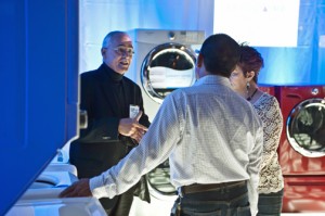 Electrolux Puerto Rico General Manager Jorge Mercado, left, meets with potential customers.