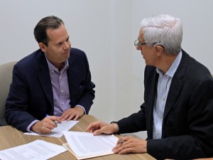 From left: Nicholas Prouty and Jon Borschow sign the collaborative agreement.