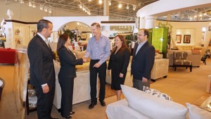 Rooms to Go and Doral executives meet to finalize the details of the newly minted partnership.