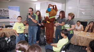 Norberto Justiniano, branch manager at FirstBank Cabo Rojo speaks to a group of students participating in the "Mochila Alegre" program.