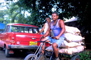 A man transports sacks of sugar on his bicycle in Havana's Miramar district. (Credit: Larry Luxner)