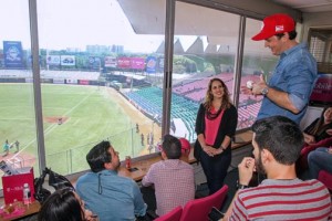 T-Mobile General Manager Jorge Martel (wearing baseball cap) discusses the carrier's new strategies during a news conference at the Hiram Bithorn Stadium in San Juan.
