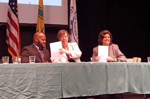 The coordinator of federal relations for the USVI, Shawn-Michael Malone, EPA Regional Director Judith Enck, and Department of Natural and Environmental Resources Secretary Carmen Guerrero, sign the MOU to address the effects of climate change.