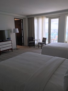 The vice-presidential suite's bedroom has two full-sized beds and an en-suite full bathroom.