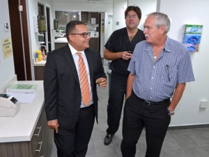 (From left) Hari Sabnani and Doctors Jorge Aldrich and Arturo Gigante tour the new lab.