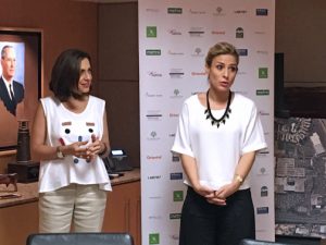 Lucienne Gigante, right, of AccessLatina, offers details of the first-round winners.