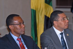 Nigel Clarke, Jamaica's ambassador plenipotentiary for economic affairs, and Prime Minister Andrew Holness discuss their new economic agenda at the U.S. Chamber of Commerce in Washington DC. (Credit: Larry Luxner)