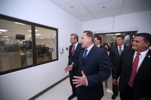 Miguel Centeno, general manager Roche Operations Ltd. in Ponce, leads Gov. García-Padilla and other government officials during a tour of the Ponce plant.