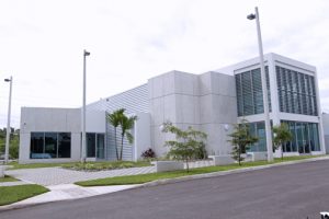 The modern, multi-story structure houses advanced technologies and specialized equipment, large kitchen areas and laboratories.