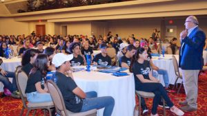 Jim Vella, president, Ford Motor Company Fund and Community Services, addresses a group of high school students at the Condado Plaza Hotel Wednesday.